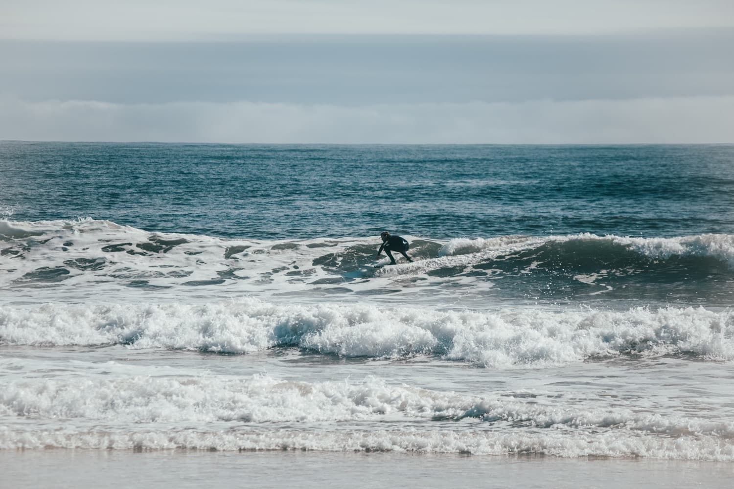 Tucker surfing on a wave